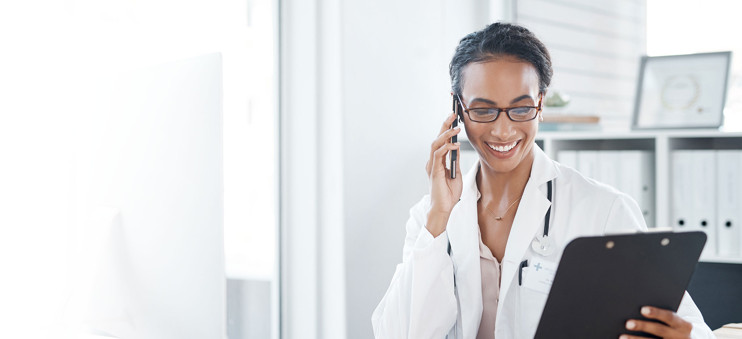 doctor smiling on phone